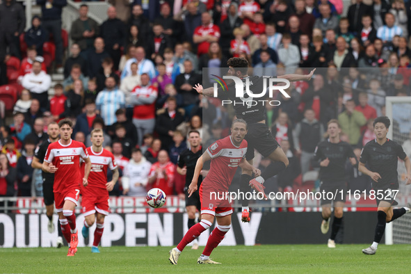 Stoke City's Thomas Cannon challenges for a header with Middlesbrough's Luke Ayling during the Sky Bet Championship match between Middlesbro...