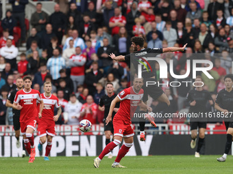 Stoke City's Thomas Cannon challenges for a header with Middlesbrough's Luke Ayling during the Sky Bet Championship match between Middlesbro...