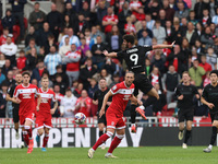 Stoke City's Thomas Cannon challenges for a header with Middlesbrough's Luke Ayling during the Sky Bet Championship match between Middlesbro...