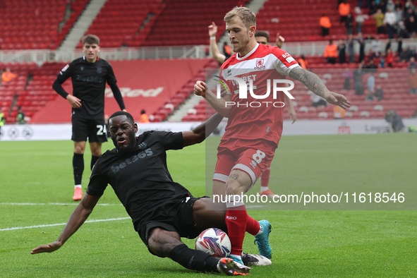 Stoke City's Junior Tchamadeu is in action against Middlesbrough's Riley McGree during the Sky Bet Championship match between Middlesbrough...