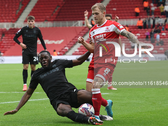 Stoke City's Junior Tchamadeu is in action against Middlesbrough's Riley McGree during the Sky Bet Championship match between Middlesbrough...