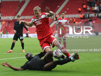 Stoke City's Junior Tchamadeu is in action against Middlesbrough's Riley McGree during the Sky Bet Championship match between Middlesbrough...