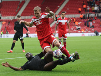 Stoke City's Junior Tchamadeu is in action against Middlesbrough's Riley McGree during the Sky Bet Championship match between Middlesbrough...