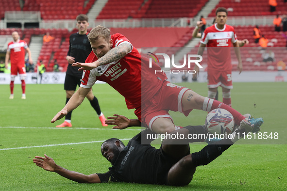 Stoke City's Junior Tchamadeu is in action against Middlesbrough's Riley McGree during the Sky Bet Championship match between Middlesbrough...