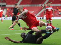 Stoke City's Junior Tchamadeu is in action against Middlesbrough's Riley McGree during the Sky Bet Championship match between Middlesbrough...