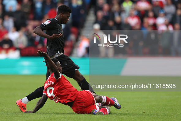 Middlesbrough's Emmanuel Latte Lath battles with Stoke City's Sol Sidibe during the Sky Bet Championship match between Middlesbrough and Sto...