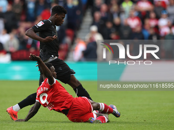 Middlesbrough's Emmanuel Latte Lath battles with Stoke City's Sol Sidibe during the Sky Bet Championship match between Middlesbrough and Sto...