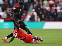 Middlesbrough's Emmanuel Latte Lath battles with Stoke City's Sol Sidibe during the Sky Bet Championship match between Middlesbrough and Sto...