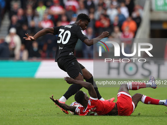 Emmanuel Latte Lath of Middlesbrough battles for possession with Stoke City's Sol Sidibe during the Sky Bet Championship match between Middl...