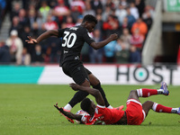 Emmanuel Latte Lath of Middlesbrough battles for possession with Stoke City's Sol Sidibe during the Sky Bet Championship match between Middl...