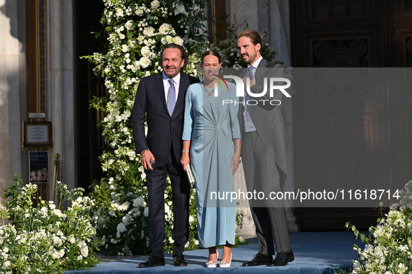 Thomas Flohr, Princess Nina of Greece, and Prince Philippos of Greece arrive at the Metropolitan Cathedral of Athens for the wedding of Prin...