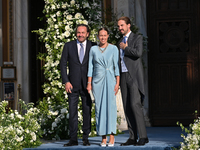 Thomas Flohr, Princess Nina of Greece, and Prince Philippos of Greece arrive at the Metropolitan Cathedral of Athens for the wedding of Prin...