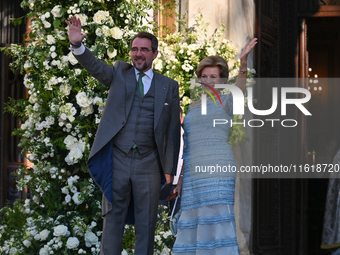 Prince Nikolaos of Greece and former Queen Anne-Marie of Greece arrive at the Metropolitan Cathedral of Athens for the wedding of Princess T...