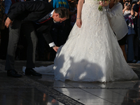 Princess Theodora of Greece, escorted by Crown Prince Pavlos of Greece, arrives at the Metropolitan Cathedral of Athens for her wedding with...