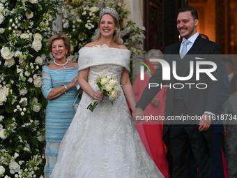 Princess Theodora of Greece and Matthew Kumar exit the Metropolitan Cathedral of Athens after their wedding in Athens, Greece, on September...