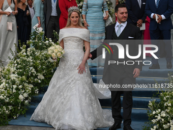 Princess Theodora of Greece and Matthew Kumar exit the Metropolitan Cathedral of Athens after their wedding in Athens, Greece, on September...