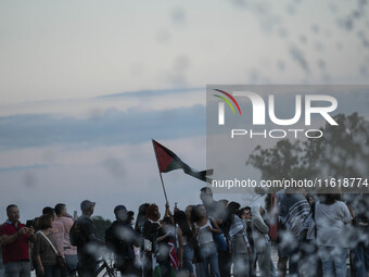 On September 28, 2024, in Washington, DC, a group of 100 protesters gathers at Georgetown Waterfront to protest the war on Palestine in Gaza...