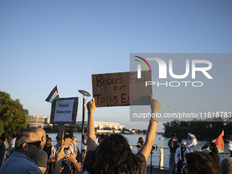 On September 28, 2024, in Washington, DC, a group of 100 protesters gathers at Georgetown Waterfront to protest the war on Palestine in Gaza...