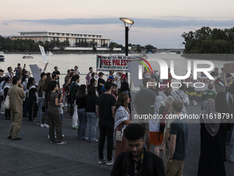 On September 28, 2024, in Washington, DC, a group of 100 protesters gathers at Georgetown Waterfront to protest the war on Palestine in Gaza...