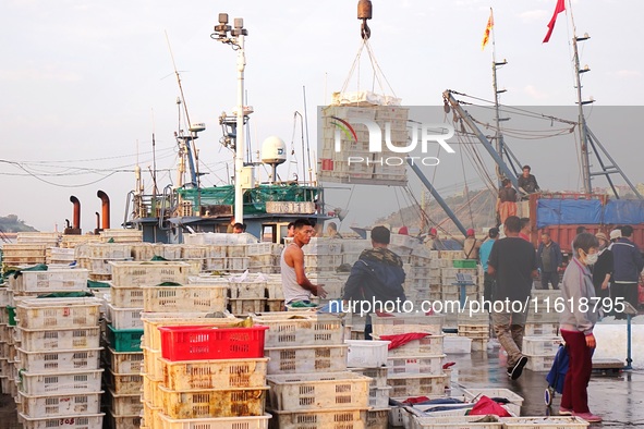 Seafood lifted ashore fills the dock at Jimiya Fishing Port in the West Coast New area of Qingdao, Shandong province, China, on September 28...