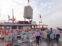 Seafood lifted ashore fills the dock at Jimiya Fishing Port in the West Coast New area of Qingdao, Shandong province, China, on September 28...