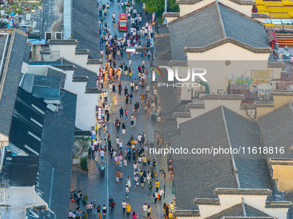 Tourists visit the Confucius Temple scenic spot in Nanjing, China, on September 28, 2024. 