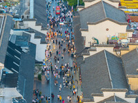 Tourists visit the Confucius Temple scenic spot in Nanjing, China, on September 28, 2024. (