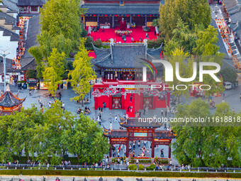 Tourists visit the Confucius Temple scenic spot in Nanjing, China, on September 28, 2024. (