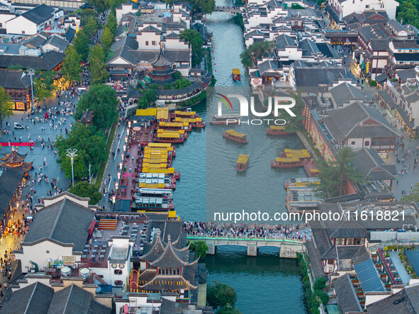 Tourists visit the Confucius Temple scenic spot in Nanjing, China, on September 28, 2024. 