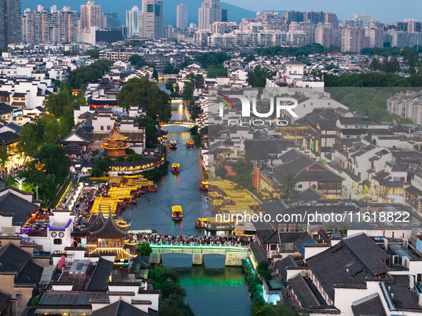 Tourists visit the Confucius Temple scenic spot in Nanjing, China, on September 28, 2024. 