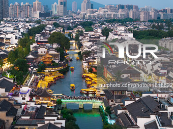 Tourists visit the Confucius Temple scenic spot in Nanjing, China, on September 28, 2024. (