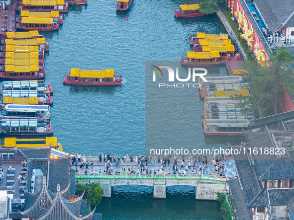 Tourists visit the Confucius Temple scenic spot in Nanjing, China, on September 28, 2024. 