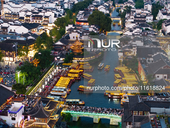 Tourists visit the Confucius Temple scenic spot in Nanjing, China, on September 28, 2024. 