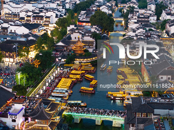 Tourists visit the Confucius Temple scenic spot in Nanjing, China, on September 28, 2024. (