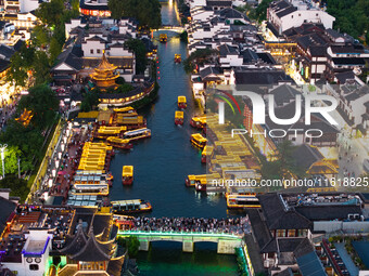 Tourists visit the Confucius Temple scenic spot in Nanjing, China, on September 28, 2024. (