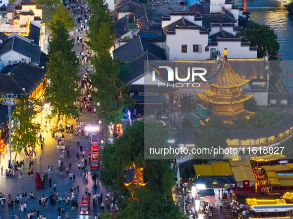 Tourists visit the Confucius Temple scenic spot in Nanjing, China, on September 28, 2024. 