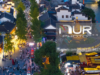 Tourists visit the Confucius Temple scenic spot in Nanjing, China, on September 28, 2024. (