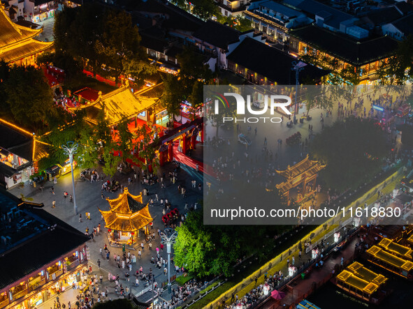 Tourists visit the Confucius Temple scenic spot in Nanjing, China, on September 28, 2024. 