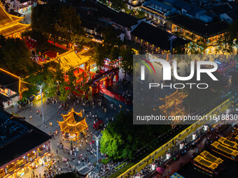 Tourists visit the Confucius Temple scenic spot in Nanjing, China, on September 28, 2024. (