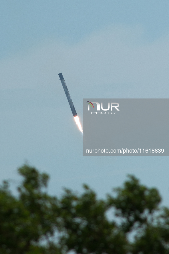 SpaceX Falcon 9 booster stage returns in a controlled landing at Cape Canaveral Space Force Station, Florida. 