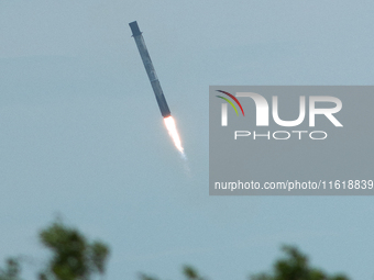 SpaceX Falcon 9 booster stage returns in a controlled landing at Cape Canaveral Space Force Station, Florida. (