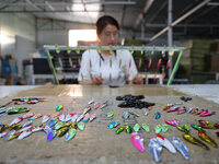 A worker works in a workshop of a fishing tackle company in Binzhou, China, on September 29, 2024. (