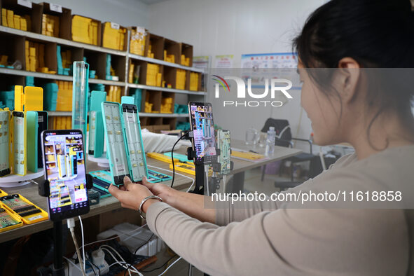 A worker works in a workshop of a fishing tackle company in Binzhou, China, on September 29, 2024. 