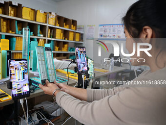 A worker works in a workshop of a fishing tackle company in Binzhou, China, on September 29, 2024. (