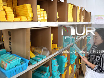 A worker works in a workshop of a fishing tackle company in Binzhou, China, on September 29, 2024. (