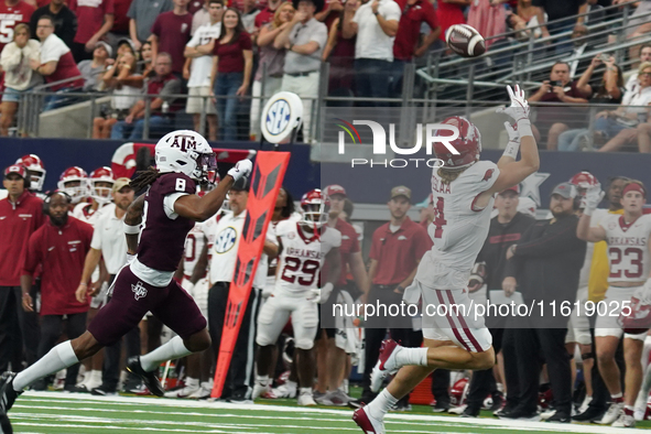 Arkansas Razorbacks wide receiver Isaac TeSlaa #4 catches a pass for a touchdown during the Southwest Classic match between the Arkansas Raz...