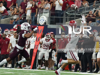 Arkansas Razorbacks wide receiver Isaac TeSlaa #4 catches a pass for a touchdown during the Southwest Classic match between the Arkansas Raz...