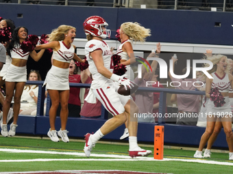 Arkansas Razorbacks wide receiver Isaac TeSlaa #4 catches a pass for a touchdown during the Southwest Classic match between the Arkansas Raz...