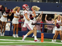 Arkansas Razorbacks wide receiver Isaac TeSlaa #4 catches a pass for a touchdown during the Southwest Classic match between the Arkansas Raz...