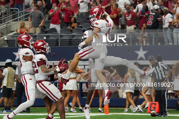 Arkansas Razorbacks wide receiver Isaac TeSlaa #4 celebrates after scoring a touchdown during the Southwest Classic match between the Arkans...